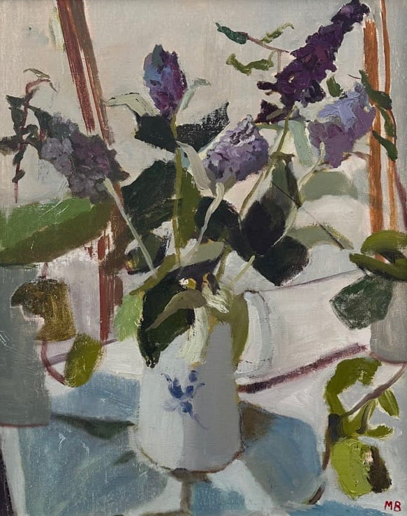 Framed painting of a still life with flowers and a vase on a dark blue wall.